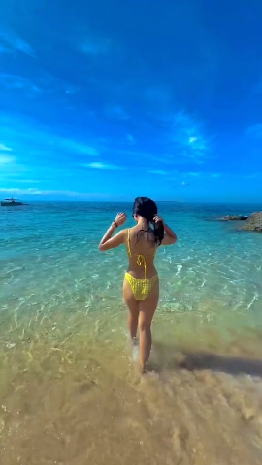 Turquoise waters of the private beach at Dasol Beach Villas, Pangasinan