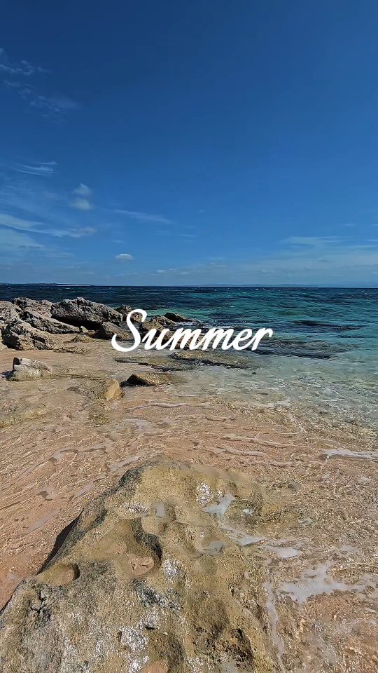 Rocky shoreline with crystal-clear turquoise water at Dasol Bay, Pangasinan